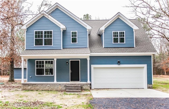 view of front of house with a porch and a garage