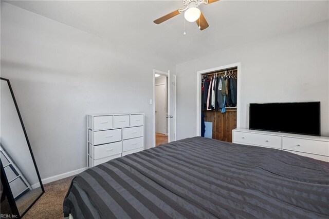 bedroom with ceiling fan, a closet, and dark colored carpet