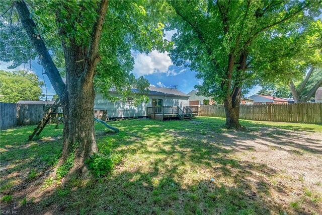 view of yard with a wooden deck