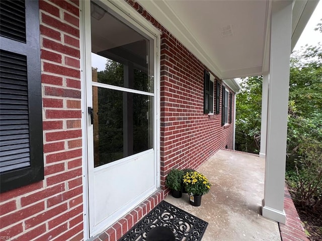 doorway to property featuring a porch