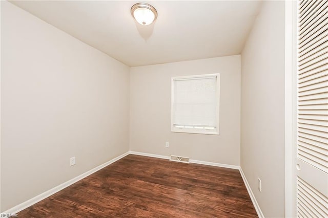 empty room featuring dark hardwood / wood-style floors