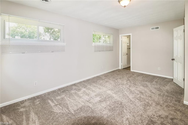 unfurnished room with carpet floors