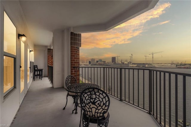 view of balcony at dusk