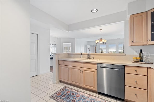 kitchen featuring light brown cabinets, an inviting chandelier, decorative light fixtures, stainless steel dishwasher, and sink