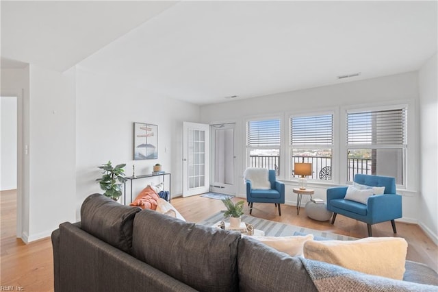 living room with light hardwood / wood-style flooring