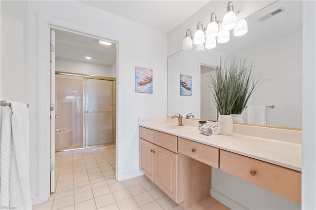 bathroom with vanity, an inviting chandelier, tile patterned floors, and an enclosed shower