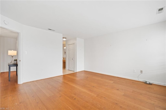 spare room with light wood-type flooring