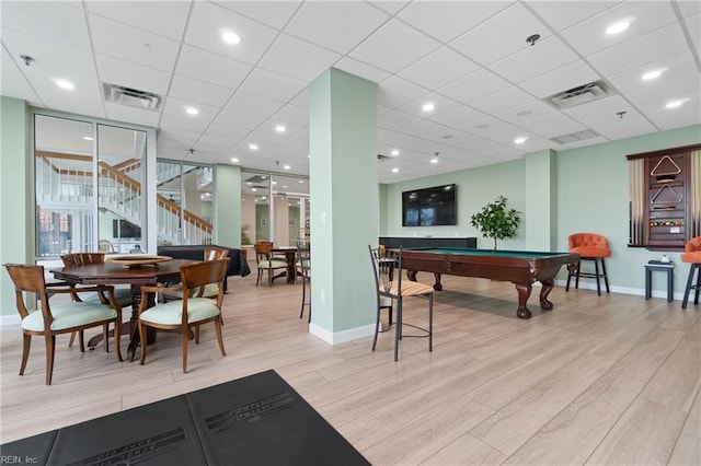 game room with light hardwood / wood-style flooring, a paneled ceiling, and pool table