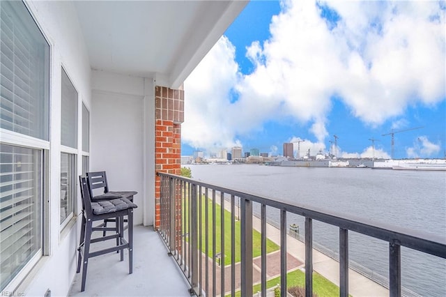 balcony featuring a water view