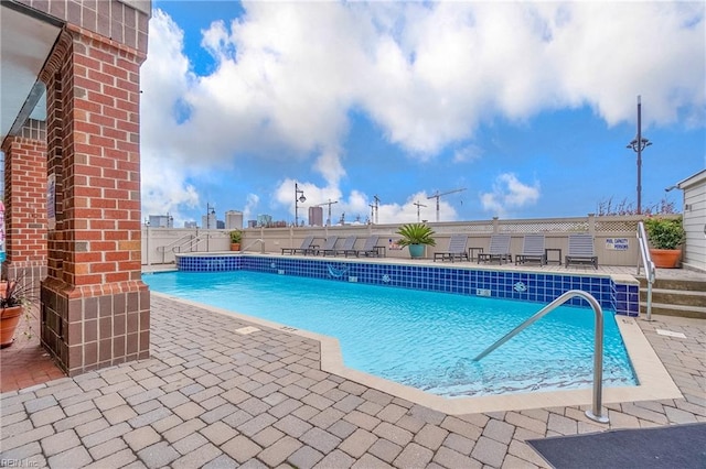 view of pool featuring a patio area