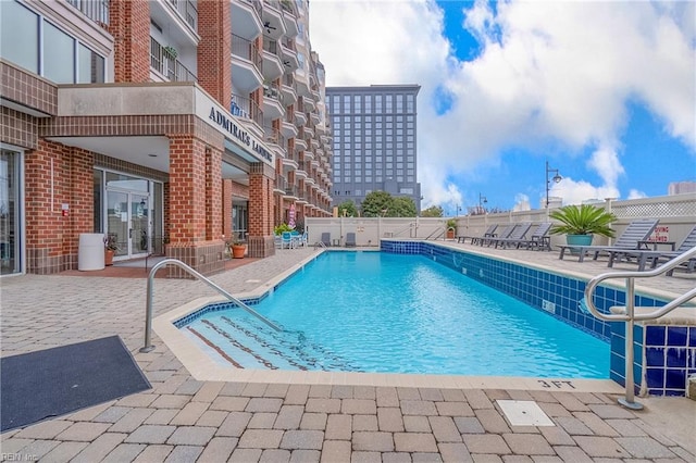 view of swimming pool with a patio