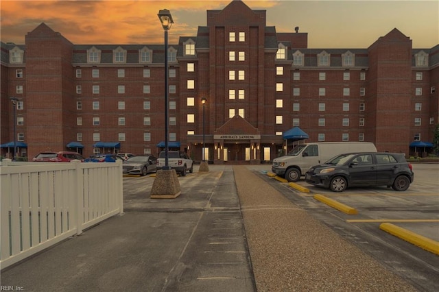 view of outdoor building at dusk