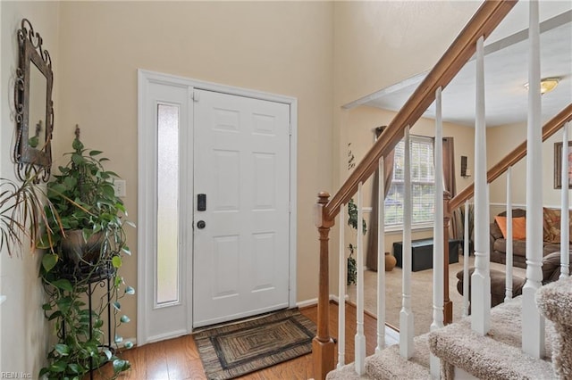 foyer entrance with hardwood / wood-style floors