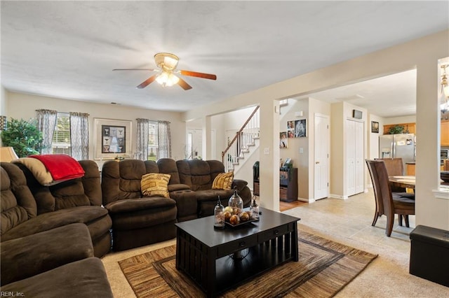 tiled living room with ceiling fan