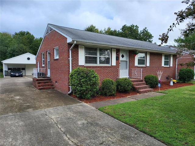 view of front of home with a garage, a front yard, and a carport