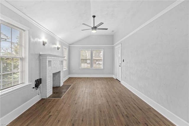 unfurnished living room with ceiling fan, a fireplace, and plenty of natural light