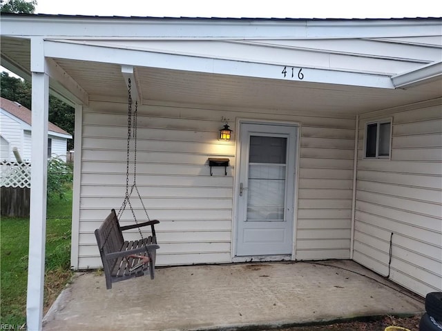 doorway to property featuring a patio area