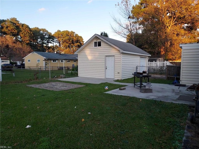 view of yard featuring an outbuilding and a patio area