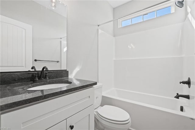 full bathroom featuring vanity, shower / bath combination, and toilet