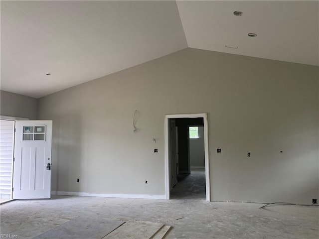 spare room featuring vaulted ceiling