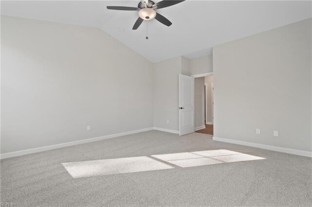 unfurnished room featuring light colored carpet, ceiling fan, and lofted ceiling