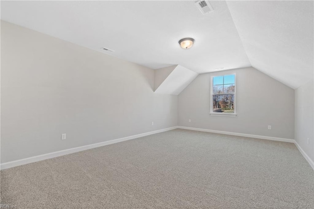 bonus room with carpet and lofted ceiling