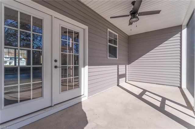 view of exterior entry featuring ceiling fan