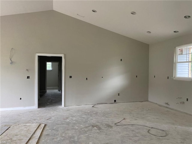 spare room with vaulted ceiling