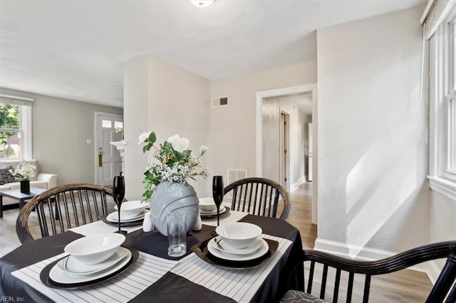 dining space featuring light hardwood / wood-style flooring