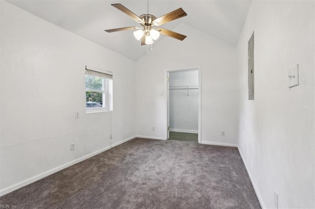 unfurnished bedroom with lofted ceiling, dark colored carpet, ceiling fan, and electric panel