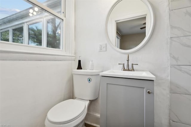 bathroom with vanity and toilet