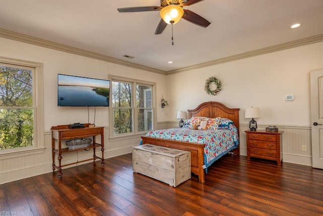 bedroom with crown molding, dark hardwood / wood-style floors, and ceiling fan