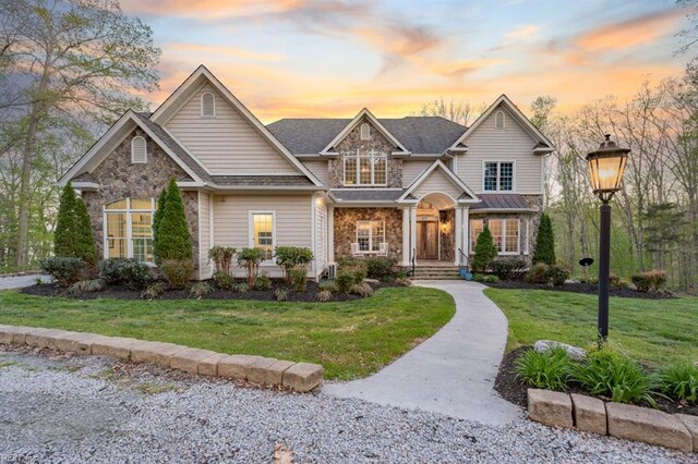 craftsman-style house featuring a lawn