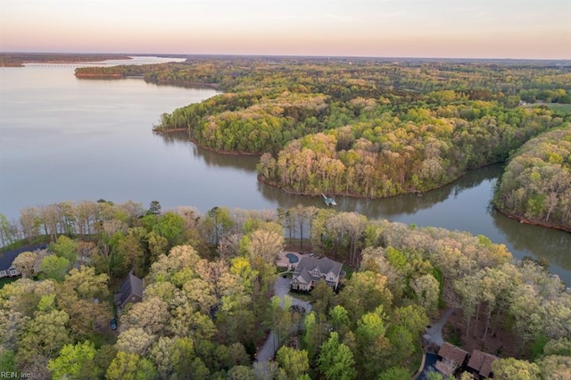 aerial view at dusk with a water view