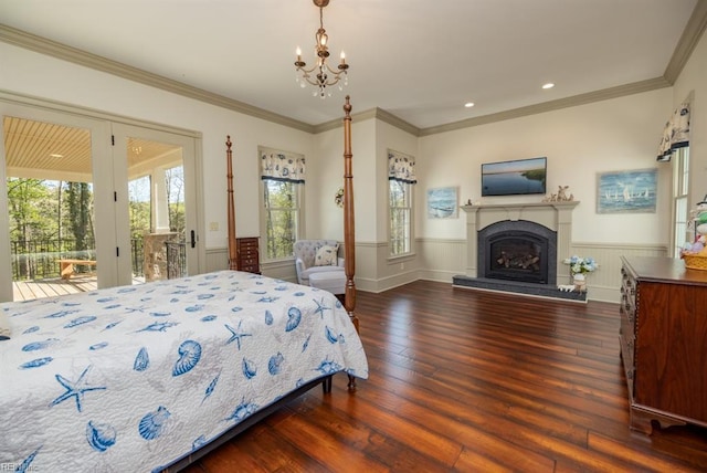 bedroom featuring access to outside, dark hardwood / wood-style floors, and ornamental molding