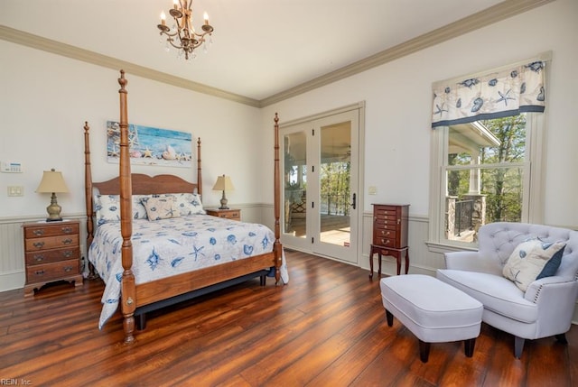 bedroom with dark hardwood / wood-style floors, access to outside, an inviting chandelier, crown molding, and french doors