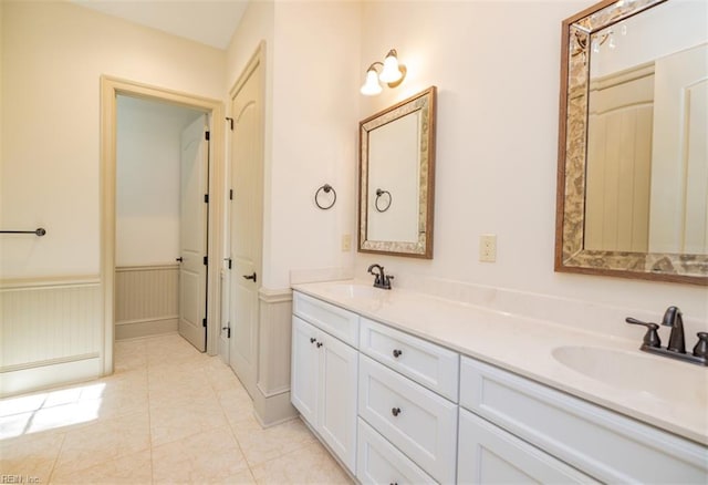 bathroom with vanity and tile patterned floors