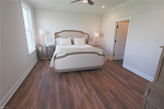 bedroom featuring multiple windows, dark hardwood / wood-style floors, and ceiling fan