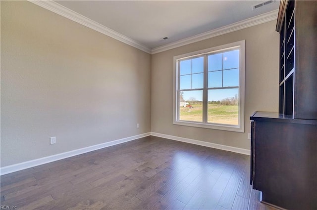 unfurnished room with ornamental molding and dark hardwood / wood-style floors