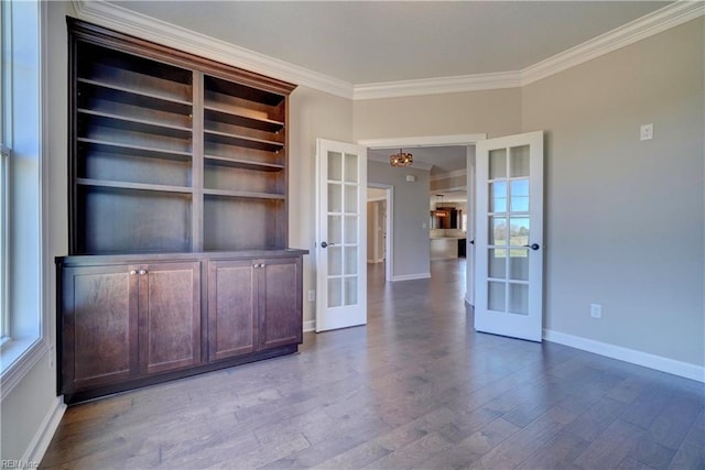 interior space featuring light hardwood / wood-style floors, french doors, and crown molding