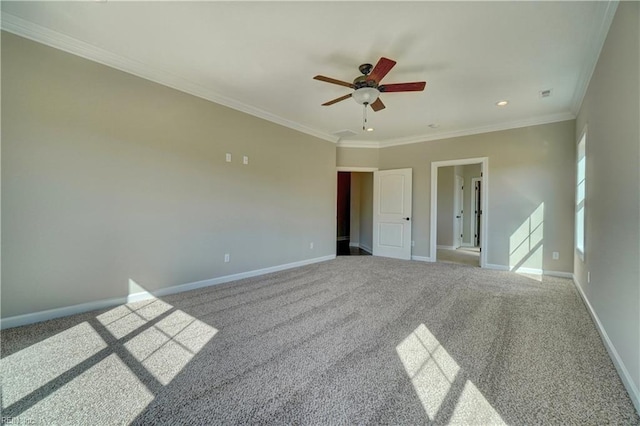 carpeted empty room with crown molding and ceiling fan