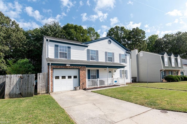 view of front property with covered porch, a garage, and a front yard