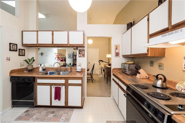 kitchen featuring white cabinets, sink, wood counters, and black appliances