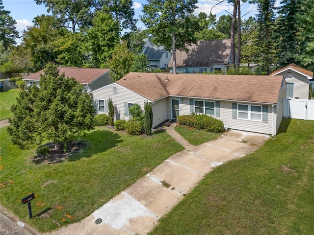 ranch-style house with a front lawn