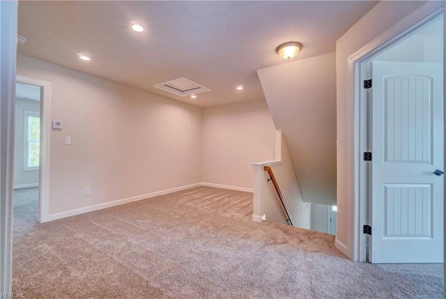 spare room featuring light colored carpet