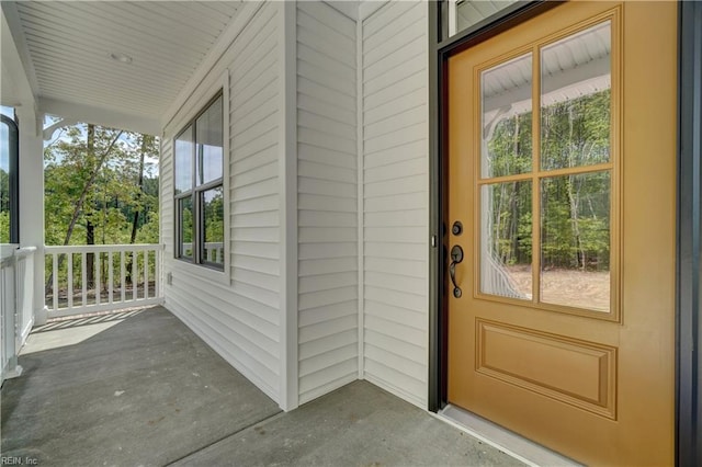 doorway to property featuring a porch