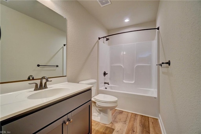 full bathroom featuring tub / shower combination, vanity, toilet, and hardwood / wood-style flooring