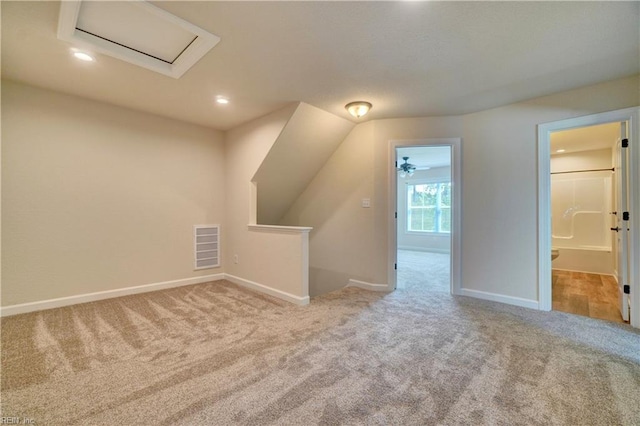 additional living space with light colored carpet