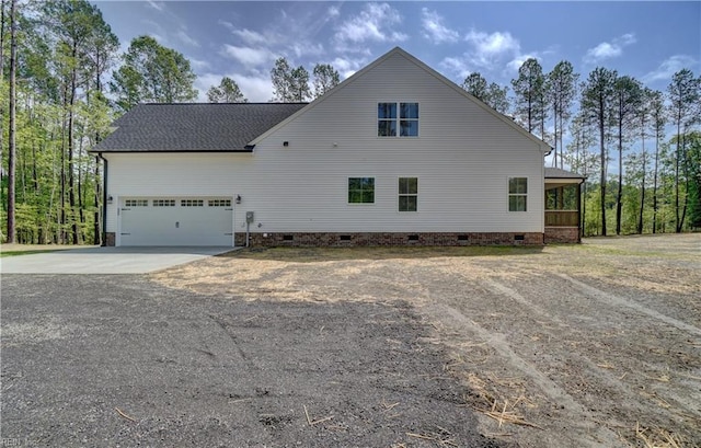 view of side of home with a garage