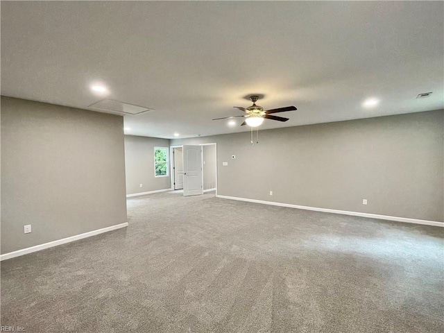 carpeted spare room with ceiling fan